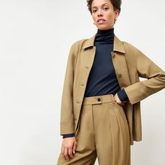 Featuring an easy fit, a waist-cinching belt, and covered buttons, the Avelyn jacket is super-sleek and charmingly retro all at once. Toss it over a T-shirt and jeans for a Power Casual look, or go for a full vintage-inspired suit with the matching Bia pants . ﻿ Made in China with fabric from Japan. Power Casual, Turtleneck Under, Vegan Leather Pants, Structured Blazer, Relaxed Jeans, Virtual Fashion, T Shirt And Jeans, Work Life Balance, Women Supporting Women