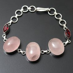 Rose Quartz Garnet Quartz Gemstone Bracelet Jewelry Gift for girl Bracelet gift For Her Sterling Silver Plated Jewelry Beautiful Bracelet Jewelry Materials Sterling Silver Plated Bracelet Size 8.4 x 0.8 Stone Name Rose Quartz Garnet Quartz Stone Color Pink, red Shipping Policy We do ship through DHL, UPS, INDIA POST. I make the gemstones myself for my valued customers so I assure you that the gemstones are Natural and are made from ethically sourced roughs. The rest of the Bracelet is made from Pink Jewelry With Stones For Gifts, Mother's Day Gemstone Bracelet, Crystal Bracelet With Stones As A Gift, Bangle Jewelry With Stones As Gift, Adjustable Gemstone Bracelet For Mother's Day, Silver Gemstone Bracelets For Mother's Day, Oval Pink Jewelry With Stones, Gift Bangle Jewelry With Stones, Round Crystal Bracelet With Stones