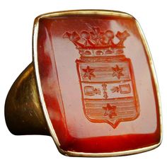 Great Nobility Intaglio Signet Ring for Men with remarkable Coats of Arms hand - engraved into the deep of hard Red banded Onyx Stone. This is a Coat of Arms of Swedish noble family of Heijkenskjöld. Very well done intaglio carving work with a lot of delicate and extremely miniature details that makes fine impression on any soft and pliable matter. Swedish hallmarks,18K, maker's hallmarks, year combo is R8 = made in 1943. Red Onyx stone with convex cut and concave cut ornament, polished to gloss Signet Ring For Men, Relief Carving, Coats Of Arms, Old Rings, Photo Equipment, Coat Of Arm, Ring For Men, Old Jewelry, Well Done