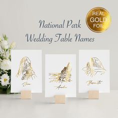 three cards with gold foiling on them and the words national park wedding table names