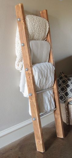 Handmade decorative blanket ladder Blanket Holder Ideas, Blanket Holder, Metal Ladder, Diy Blanket, First Apartment Decorating, Plate Rack, Apartment Decoration, Ladder Rack, Cute Dorm Rooms