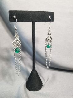 Delicate Celtic spiral accented with chains and a beautiful green bead. If you want a larger quantity please just send me a message 🙂 Irish Earrings, Celtic Spiral, Celtic Earrings, Making Stuff, Pagan Jewelry, Spiral Earrings, Handmade Wire Jewelry, Earrings Green, Celtic Jewelry