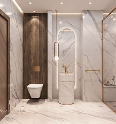 a bathroom with marble walls and flooring in white, gold and grey colors is shown