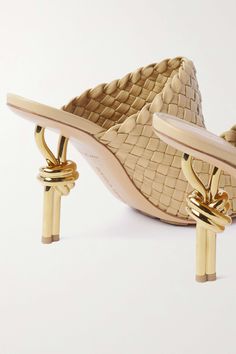 Chic Formal Mules With Woven Leather, Chic Formal Woven Leather Mules, Formal Woven Leather Mules, Elegant Formal Mules With Woven Sole, Designer Leather Heels With Intrecciato Weave, Elegant Woven Leather Open Toe Mules, Designer Gold High Heel Mules, Luxury Beige Evening Mules, Elegant Heels With Intrecciato Weave And Open Heel