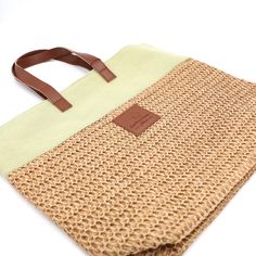 Summer Raffia Tote Treat yourself to this stylish and functional Summer raffia tote bag. Whether you are beachgoing, lounging around the resort, or heading out for the day on a sunny afternoon, this bag is your go-to resort wear tote. Made from raffia and canvas with a cotton lining, this bag is large enough to store your must-haves for your day out. Available in beige or soft apple green canvas trim. The handles and logo patch are made with vegan leather. Sunny Afternoon, Apple Green, Resort Wear, Straw Bag, Patch Logo, Burlap Bag, Vegan Leather, Reusable Tote Bags, Handles