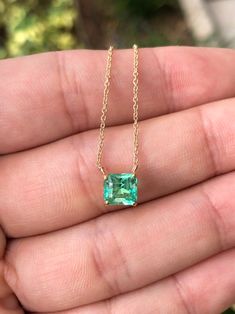 Featured here is a 1.32-carat stunning, Colombian emerald necklace in fine 14K yellow gold. Displayed in the center is a medium-light green emerald with incredible crystal clarity, accented by a simple four-prong gold mount, allowing for the emerald to be shown in full view. The earth mined, green Colombian emerald has a desirable lush green color with excellent qualities. An 18 inch is attached to the emerald pendant. This necklace is ideal for everyday use and is the perfect accessory to any o Dainty Luxury Emerald Necklace As Birthstone, Chunky Gold Chain Necklace, Columbian Emeralds, Chunky Gold Chain, Jewels Rings, Hot Jewelry, Colombian Emeralds, Emerald Pendant, May Birthstone