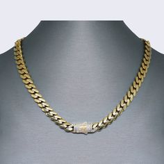 Introducing our stunning 14K Miami Cuban CZ Choker Set, the perfect addition to any jewelry collection. Crafted with high-quality 14K gold, this set exudes luxury and elegance. The necklace measures 17 inches in length and has a thickness of 8mm, making it a bold and eye-catching piece. The matching bracelet measures 7.5 inches in length and has a thickness of 7mm, completing the set with a cohesive and stylish look. The intricate Miami Cuban link design adds a touch of sophistication, while the Elegant Luxury Gold Cuban Link Necklace, Cuban Link Diamond Necklace With Diamond Accents, Luxury Gold Chain Necklace With Diamond Accents, Luxury Yellow Gold Chain Necklace With Brilliant Cut, Classic Gold Chain Necklace With Diamond Accents, Elegant Gold Diamond Necklace With Curb Chain, Classic Cuban Link Cubic Zirconia Necklace, Luxury Cuban Link Necklace With Cubic Zirconia, Gold Cubic Zirconia Diamond Necklace In Cuban Link