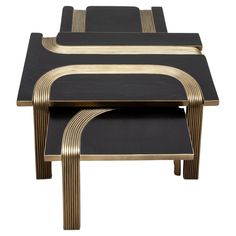 two black and gold nesting tables