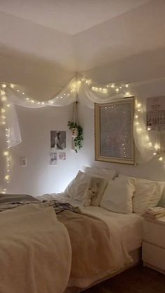 a bedroom with lights strung from the ceiling