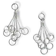 Earrings have a suspended from a ring at the ear are multiple silver strands each ended in a hoop that are interlinked for a unique pattern with a modern feel Sterling Silver Drop Jewelry With Dangling Charms, Modern Sterling Silver Jewelry With Dangling Charms, Silver Drop Jewelry With Dangling Charms, Silver Metal Wrap Drop Earrings, Sterling Silver Drop Hoop Earring, Sterling Silver Single Drop Hoop Earring, White Gold Dangle Hoop Earrings In Sterling Silver, White Gold Sterling Silver Dangle Hoop Earrings, Silver Teardrop Single Wrap Earring