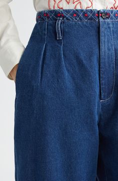 The American luxury label puts its signature artisanal spin on classic wide-leg jeans revamped with colorful geometric embroidery along the waist and hemline. Structured nonstretch denim and trouser-inspired pintucks along the thighs further refine the look. 28 1/2" inseam; 17" leg opening; 13 1/2" front rise; 17 1/2" back rise (size 26) Zip fly with button closure Side-seam pockets; back button-welt pockets 100% cotton Dry clean Imported Designer Clothing Indigo Wide Leg Jeans For Work, Classic Indigo Wide Leg Bottoms, Elegant Wide Leg Dark Wash Jeans, Indigo Wide Leg Flare Jeans, Geometric Embroidery, Denim Details, Pin Tucks, Welt Pockets, Wide Leg Jeans