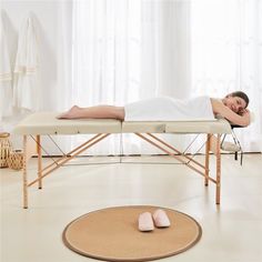 The soft cushion of the massage table gives you a smooth and comfortable feeling; the beech wood legs give you strong and stable support. The height of this massaging bed is adjustable by turning the knobs on the legs. The users can always find suitable positions. This massage bed does not require any tools. Just open the massage bed and stretch the legs to the position. It is easy to assemble, use and carry around. Size: 84" L x 36.5" W x 25.5-34" H.  Color: White. Massage At Home, Massage Equipment, Massage Bed, Massage Tables, Come And Take It, Professional Massage, Massage Table, Towel Hanger, Table Height