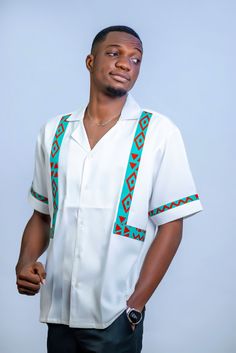 Introducing the Elegant White Ankara Dashiki Men's Shirt--where tradition meets sophistication in the most stylish way possible. This African Print Patterned Top is your go-to piece when you want to make a grand entrance at weddings, parties, or any special occasion. Designed with a modern twist on classic African style, this shirt features a crisp white base adorned with vibrant Kente Design accents. It's not just a shirt; it's a statement of elegance and cultural pride that's sure to turn head White Traditional Tops With Traditional Patterns, Traditional White Short Sleeve Sets, Traditional Fit White Top, Traditional White Tops, Traditional White Top, Traditional Fitted White Shirt, Dashiki Shirt, African Tops, Style Africain