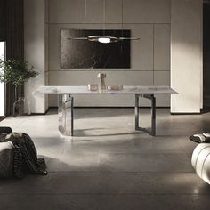 a modern dining room with marble table and chairs