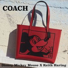 Coach Disney Mickey Mouse X Keith Haring Highline Tote Brand New With Tag Limited Edition Product Details Crossgrain Leather Fabric Lining Handles With 9 3/4" Drop 14 1/4" (L) X 12 1/4" (H) X 4 1/4" (W) Tm & Disney. Keith Haring Foundation. Disney Red Rectangular Bag, Disney Red Rectangular Bags, Disney Mickey Mouse Rectangular Bag, Mickey Mouse Tote Bags For Daily Use, Red Disney Travel Bag, Disney Red Travel Bag, Coach Disney, Celine Luggage Bag, Keith Haring