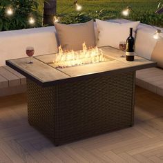 a fire pit sitting on top of a wooden table