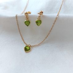 Peridot Jewelry Set, peridot necklace, peridot earrings, Heart Pendant Necklace, Dainty Gold Filled necklace, Minimalist Jewelry  𖤓 Materials: Sterling Silver 925 covered in 24kt gold, lab made gemstones.  𖤓 Heart Size : 5 mm 𖤓 Earring stud ball size: 4 mm 𖤓 Chain length: 16 inches plus 1 inch extender : ̗̀➛ Comes in velvet pouch : ̗̀➛ We Ship Worldwide : ̗̀➛ go back to Shop front: https://www.etsy.com/shop/StevaniJewels ⋆｡ ﾟ☁︎｡ ⋆｡ ﾟ☾ ﾟ｡ ⋆ More Info ⋆｡ ﾟ☁︎｡ ⋆｡ ﾟ☾ ﾟ｡ ⋆ **Stunning Peridot Eleg Dainty Green Heart Jewelry, Green Dainty Jewelry For Valentine's Day, Dainty Green Peridot Jewelry, Dainty Green Heart Pendant Necklace, Green Heart-shaped Birthstone Jewelry, Green Heart Charm Jewelry For Wedding, Lime Green Birthstone Jewelry Gift, Lime Green Birthstone Jewelry For Gifts, Lime Green Jewelry For May Birthstone Gift