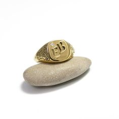 The initial signet ring is a classic piece of jewellery for both men and women. Bring a little bling with this unique square shaped initial signet ring in 14k gold and 0.05 diamond setting with your choice of initial letters made especially for you. The monogram seal ring is polished to a high finish and decorated with delicate ornamental design that will certainly be noticed as a refreshing element in any day or night outfit. This monogram ring is a perfect gift for a birthday, anniversary, as Classic Diamond Signet Ring With Initials, Classic Diamond Engraved Ring With Initials, Rectangular Diamond Signet Ring As Gift, Classic Personalized Diamond Ring, Classic Diamond Initial Ring As Gift, Classic Engraved Diamond Signet Ring, Diamond Signet Ring With Initials For Gift, Diamond Signet Ring With Initials As A Gift, Diamond Engraved Ring With Initials For Gift