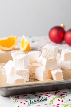 marshmallows and orange slices on a tray