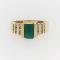 Vintage Emerald And Diamond Ring- 14k Yellow Gold  Size: 4.75 Weight: 3.3 g Stone info:  Emerald: 0.7 Ct  Diamond; 0.3 CTW Contact us for resizing  More pictures available upon request. We offer a risk free 30 - day return policy if you are not completely satisfied, you get your money back! If you are not happy for any reason, return for a full refund less shipping within 30 days.  Vintage items are unique, highly collective, may show light wear but in very good condition. We offer a risk free 3 Green Diamond Channel Set Rings, Formal Fine Jewelry Emerald Ring Channel Set, Classic Green Channel Set Ring, Classic Formal Emerald Ring With Channel Set, Classic Formal Emerald Ring Channel Set, Yellow Gold Channel Set Emerald Ring, Formal Yellow Gold Emerald Ring Channel Set, Fine Jewelry Green Channel Set Ring, 14k Gold Emerald Cut Channel Set Rings