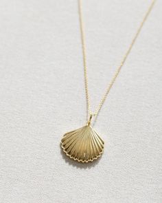 This beautiful Gold Sanibel Necklace is crafted from 14k gold vermeil and shaped like a flat scallop shell. A timeless piece and a reminder of the graceful beauty of the ocean. Scallop Shell, Scallop Shells, Jewelry Case, Free Jewelry, Gold Vermeil, Timeless Pieces, The Ocean, Gold, Beauty