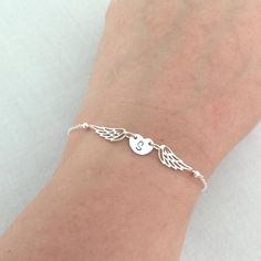 Loss of Father Bracelet, Mother Memorial Bracelet, Sympathy Gift, Pet Loss Gifts, Infant Loss, Angel Wing Bracelet, Initial BraceletAvailable in Sterling Silver, 14K Gold Filled and 14K Rose Gold FilledPlease drop a message of initial in the note box at checkout.Specification. Angel Wing size 6 x 14.5mm. Heart Disc size 8.5 x 6.6mm. Length includes angel wings, heart disc, jump ring and clasp. Comes in our signature satin pouchIMPORTANT:Usually jewellery in the pictures looks bigger than in real Heart-shaped Sterling Silver Bracelet For Birthday, Sterling Silver Heart Bracelet For Birthday, Silver Friendship Bracelets Gift, Silver Spiritual Bracelet For Birthday, Loss Of Father, Angel Wing Bracelet, Heart Disc, Bracelet Initial, Medical Bracelet