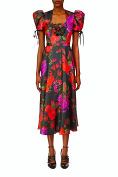 Tailored in Rodarte’s dramatic black and red silk twill floral print, this modern midi has a fitted bodice that eases into a full circle skirt. A single hand molded printed silk flower accents its sweetheart neckline and a belt adorns the waist. Short puff sleeves edged by black piping and tied in bows add the perfect Red Floral Print Midi Dress For Evening, Evening A-line Midi Dress With Floral Print, Floral Print Satin Midi Dress For Garden Party, Floral Print A-line Midi Dress For Evening, Cocktail A-line Midi Dress With Floral Print, Cocktail Satin Midi Dress With Floral Print, Floral Print A-line Midi Cocktail Dress, Evening Midi Dress With Floral Print In Tea Length, Red Silk Midi Dress With Floral Print