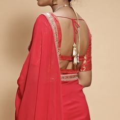 This set features a wide neck neck blouse tailored in rose red and gold brocade. It is teamed with a matching georgette sari with scallop, zari and dori borders and gold tassels at the palla. Includes Satin Underskirt Composition: Blouse: Brocade Silk, Sari : Viscose Georgette All products can be customised for sleeves, length of blouse and neck design Delivery : 2 weeks as the product is hand crafted. Check Size Guide or choose MySize for free customisation (All Sizes above XL can be made at 15 Brocade Blouse, Brocade Blouses, Gold Brocade, Indian Wedding Wear, Silk Sari, Wedding Wear, Red And Gold, Salwar Kameez, Indian Outfits