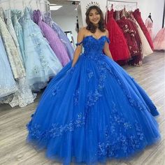 Step into a world of elegance and beauty with the Royal Blue Off-Shoulder Ball Gown with Flowers Tulle Quinceanera Dress. This stunning ball gown is crafted from soft, airy tulle, creating a dreamy, ethereal look that flows gracefully with every movement. The rich royal blue color adds a regal touch, making this dress the perfect choice for your quinceanera or any grand celebration. The off-the-shoulder neckline adds a romantic and feminine appeal, beautifully accentuating your shoulders and nec Royal Blue Quince Dresses Quinceanera, Royal Blue Ball Gown For Quinceanera During Prom Season, Blue Quinceanera Dress With Sweetheart Neckline For Gala, Blue Sweetheart Neckline Dress For Sweet 16, Blue Tulle Quinceanera Dress For Gala, Blue Tulle Quinceanera Dress For Banquet, Blue Quinceanera Dress For Prom Season, Blue Quinceanera Gown With Sweetheart Neckline, Royal Blue Gown For Quinceanera And Prom Season