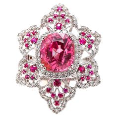 18K WHITE GOLD 94 DIAMONDS 1.13 CARATS 32 NO-HEAT BURMA RUBIES 0.53 CARATS 1 NO-HEAT BURMESE PINK SPINEL 5.64 CARATS Experience unparalleled luxury with our exquisite The Barbie Spinel ring. Featuring a 5.46 carat pink Spinel from Burma, this unheated gemstone radiates captivating luster. Crafted in 18k white gold with a floral pattern, the ring showcases 94 diamonds totaling 1.13 carats, complementing the Spinel's hue. Additionally, 32 unheated Burmese rubies totaling 0.53 carats add regal allu Gothic Engagement Ring, Heritage Jewellery, Spinel Ring, Pink Spinel, Historical Jewellery, Diamond Cocktail Rings, Wedding Rings Vintage, Royal Jewelry, Dream Jewelry