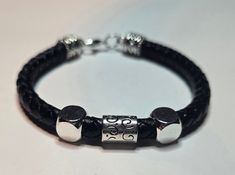 Genuine leather round braided black bracelet with silver accent. Perfect for men and women. Handmade Modern Black Braided Bracelets, Handmade Modern Black Braided Bracelet, Wedding Bracelets, Black Bracelet, Wedding Jewelry Bracelets, Black Bracelets, Silver Accents, Wedding Bracelet, Wedding Jewelry