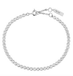 Elevate your style with our Silver Row Bezel Set Bracelet. The rows of sparkling silver are elegantly bezel set, creating a luxurious and sophisticated accessory. This bracelet is perfect for adding a touch of glamour to any outfit. Experience the beauty and quality of our premium bracelet. • Material: 925 Sterling Silver with Rhodium Plating with Cubic Zirconia• Bracelet length: 165mm with 20mm extender• Weight: 4.0g Classic Silver Tennis Bracelet With Sparkling Details, Elegant Adjustable Tennis Bracelet With Bling, Classic Tennis Bracelet With Sparkling Stones For Party, Classic Crystal Bracelet With Sparkling Stones For Party, Elegant Silver Tennis Bracelet With Bling, Classic Silver Sparkling Tennis Bracelet, Classic Crystal Bracelets For Party, Elegant Bling Chain Bracelet, Elegant Adjustable Bling Tennis Bracelet