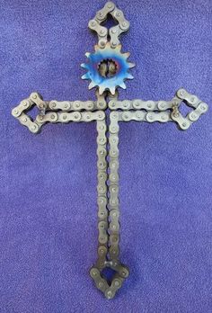 a cross made out of chains on a blue background