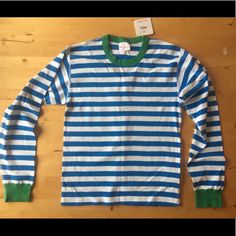 Really Cute Nwt Hanna Andersson Striped Top. Size S Unisex (Equivalent To Women’s Medium), Turquoise And White Stripes With Green Trim (Last Pic Of Sleeve Detail Shows Closest To Actual Color. Pics Showing It Flat On Table Seem A Bit Darker.). 17 1/2” Across At Bust Lying Flat (See Last Pic) Blue Relaxed Fit Tops With Contrast Stripes, Relaxed Fit Blue Tops With Contrast Stripes, Spring Blue Tops With Contrast Stripes, Epic Clothes, Fall Winter Trends, She Is Clothed, Striped Long Sleeve Shirt, Winter Trends, Hanna Andersson