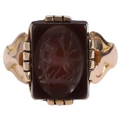 This late Georgian / early Victorian 18K rose gold ring holds a rectangular-cut deep brown sardonyx gemstone that has been artfully carved -or etched, rather- to depict a horse trotting among the tall grass. Rendered with superb artistry and skill, this intaglio honors one of England's most beloved animals. Almost certainly of English origin, this antique treasure is in excellent condition for its age. The carved intaglio is in excellent condition, free from fractures or chips. The stone is held in place by popular mounting techniques of the era with intaglio stones and features several flat prongs on all sides of the stone holding it in place. It measures 13.33mm tall, 9.93mm wide, and with a thickness of approximately 3mm. The over two-hundred-year-old ring is perfectly wearable today, b Horse Trotting, Horse English, Old Rings, Deep Brown, Signet Ring, 18k Rose Gold, Rose Gold Ring, Or Rose, Gold Ring