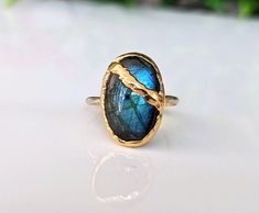 Affordable Luxury! Stand out from the crowd with our unique Labradorite Kintsugi Ring - Uniquely Handcrafted with care using the finest ethically sourced crystals and gemstones. Discover the perfect one-of-a-kind gift with one of our unique gemstone rings - Handmade with Love in Canada. Kintsugi Ring, Broken Pottery Jewelry, Kintsugi Jewelry, Blue Crystal Ring, Unique Promise Rings, Raw Gemstone Jewelry, Heavy Coat, Gold Cocktail Ring, Gold Cocktail