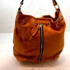 Nwt Pretty Nila Anthony Bag! Beautiful Details, Fun Zippers And So Functional. Can Be A Shoulder Bag, Hand Bag Or Worn As A Backpack On One Side (See Photos). Gorgeous Cognac Color! Orange Bags With Zipper Closure For Daily Use, Brown Bucket Satchel With Zipper Closure, Chic Bucket Satchel With Zipper Closure, Orange Leather Shoulder Bag With Zipper Closure, Orange Satchel Bag With Zipper Closure, Casual Bucket Hobo Bag With Zipper Closure, Orange Shoulder Bag With Zipper For Shopping, Orange Bucket Bag For Travel, Trendy Cognac Shoulder Bag For Travel