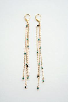 ★★★Graze those shoulders with petite turquoise gemstones. Flirty and whispery, these earrings are a fashion accessory. + Turquoise. 14K Gold Fill Lever Back Ear Wire. 14K Gold Fill Chain. + Length: Pick between 5 inches (shown in picture) and 3 inches.+ Earrings are ready to ship.+ Your earrings will come in a jewelry box, tied with a ribbon.➤➤ Have a question about this product, reach out to me here ➙ https://www.etsy.com/conversations/new?with_id=9057464&referring_id=5772224&referring_ Elegant Turquoise Earrings With Dangling Beads, Diy Earrings Dangle, Boho Wedding Earrings, Shoulder Duster Earrings, Duster Earrings, Amazon River, Long Gold Earrings, Greenwich Ct, Mother Of Pearl Earrings