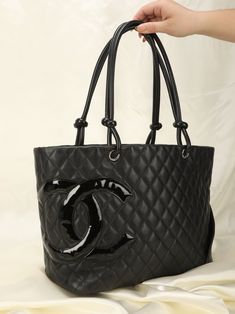 CONDITION SCALE:??¨GOOD . . Up for grabs is a stunning Chanel lambskin tote??¨bag in the iconic Cambon style.??¨Large size allows this piece to be a great??¨bag to haul everything in for the day. Pair with a large coat or trench with some sneakers or flats. A classic piece to enjoy for years! Currently going online for over $2k!??¨ Please note:??¨Some??¨rubbing on bottom corners. In overall good vintage condition!??¨ In order to meet the current demand and given the??¨nature of sourcing inventory, all sales are final. Please be sure to review all pictures and ask any questions prior to making a purchase! To prevent any form of fraud, I??¨keep video records of??¨myself??¨packaging??¨and dropping off each order, and??¨all??¨orders ship with??¨tracking and??¨signature??¨confirmation. Please e Chanel Cambon, Chanel Tote, Bottega Veneta Shoulder Bag, Rose Gold Hardware, Chanel Bags, Timeless Handbag, Luxe Fashion, Exclusive Bag, Large Tote