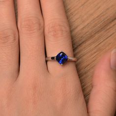 It is a lab sapphire ring. The main stone is 7 mm*7 mm cushion cut.weight about 1.94 carats. The basic metal is sterling silver and plated with rhodium. To change the metal to a solid gold (white/rose) or platinum is also available, please ask for a quotation if you want. You can also go to my shop Home for more elegant rings: https://www.etsy.com/shop/godjewelry?ref=hdr_shop_menu Sapphire is the September birthstone. More sapphire rings: https://www.etsy.com/shop/godjewelry?section_id=20715031 Sapphire Solitaire Jewelry In Cushion Cut, Sapphire Solitaire Jewelry With Cushion Cut, White Gold Sterling Silver Cushion Cut Sapphire Ring, White Gold Cushion Cut Sapphire Ring In Sterling Silver, Sapphire Cushion Cut Sterling Silver Ring, Cushion Cut Sapphire Ring Gift, Cushion Cut Sapphire Solitaire Jewelry, Cushion Cut White Gold Sapphire Ring In Sterling Silver, Cushion Cut Lab-created Sapphire Promise Ring