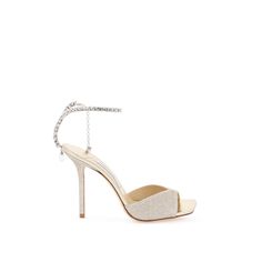 Jimmy Choo Saeda Sandals With All-Over Glitter And Characterized By A Crystal Strap With Drop Charm. Laminated Leather Insole And Leather Sole. Materal: 100% Tr, 100% Calf Leather. Made In: Italia. Color: Gold. Collection: Fall - Winter 2023. Sku: Saeda Sandal 100 Gjv. Heel Height: 10 Cm. Modecraze Is An Online Platform That Offers The Best Designer Products From Europe To Customers All Over The World. Our Exclusive Partnerships With European Retailers Ensure That We Curate A Wide Selection Of A Luxury Sparkling Open Toe Heels, Luxury Open Toe Sparkling Sandals, Luxury Sparkling Open Toe Sandals, Luxury High Heel Sparkling Sandals, Luxury Sparkling High Heel Sandals, Luxury Sparkling Sandals For Gala, Luxury High Heel Glitter Sandals, Luxury Sparkling Sandals With Ankle Strap, Luxury Sparkling Ankle Strap Sandals