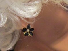 "Do you like flower earrings?  Then take a look at these black enamel clip earrings.  These cute vintage earrings are in the shape of a flower with a pearl center.  Each petal is framed in gold tone metal which very nicely sets off the black enamel. The earrings have a 7/8\" diameter and are very light weight. Check out our listings in \"zoom\" mode (just click on the \"zoom\" link under an image on the right hand side).  Depending on the size of the original image in a listing, you may be able Luxury Vintage Black Clip-on Earrings, Butterfly Costume, Costume Jewelry Rings, Images Vintage, Flower Clip, Vintage Butterfly, Pearl Flower, Clip Earrings, Vintage Bracelets