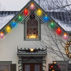 a house decorated with christmas lights and decorations