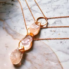 This handmade, copper electroformed Rose Quartz necklace has been crafted with love and intention to serve the wearer's highest good. It features one crystal pear-shaped raw Rose Quartz crystal on a pure 24" copper chain. Each Gem and I piece is unique and one-of-a-kind, so please leave room for variances. Unlock the incredible power of Rose Quartz - the ultimate stone for your Heart Chakra. Its ability to invite unconditional love and deep inner healing is truly unmatched. Use it to attract all kinds of love and deepen your relationships. Let it guide you toward understanding the importance of self-love and self-forgiveness, which are crucial for embracing true love. Rose Quartz uniquely can transform feelings of pain and grief into inner peace and self-soothing. Rose Gold Rose Quartz Jewelry For Meditation, Rose Gold Crystal Necklaces For Jewelry Making, Rose Gold Spiritual Crystal Gemstone Necklaces, Healing Rose Gold Crystal Necklace With Gemstone, Spiritual Rose Gold Necklaces With Natural Stones, Spiritual Rose Gold Necklace With Natural Stones, Rose Gold Crystal Pendant Necklace For Jewelry Making, Spiritual Rose Gold Pendant Crystal Necklace, Spiritual Rose Gold Wire Wrapped Necklaces