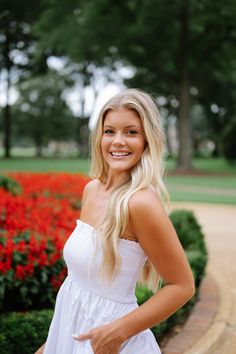 This stunning Lotus Dress in White features a strapless design with a smocked top for a flattering fit. It hits at a stylish midi length and is complete with functional pockets for added convenience. The waist seam detail adds a touch of elegance to this versatile dress that is perfect for any occasion. 100% cotton Not lined Model is 5'6" with a 34" bust, 27" waist, and 36" hips wearing a size small Size rec: S 0-4 M 4-6 L 8-10 Chic Maxi Dress With Smocked Back And Straight Neckline, Chic Smocked Back Tube Top For Beach, Day Out Ruched Strapless Sundress, Ruched Strapless Sundress For Day Out, Summer Sleeveless Tube Top With Smocked Back, Summer Tube Top With Smocked Bodice For Day Out, Chic White Smocked Bodice Tube Top, Brunch Midi Dress With Smocked Bodice And Straight Neckline, Strapless Tube Top With Smocked Back For Day Out