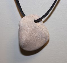 A stone with a natural hole was found at the coast of the  Baltic Sea. Water and sea currents have made this hole in this stone. In people, these stones are called "Chicken God". Since ancient times, it is considered a talisman. Dimensions, approximately : 2,7cm x 2,3cm x 1,20 cm (1,1"x0,9"x0.4") Weight, approximately: 9 g According to legends, the stone brings good luck and health. History unremarkable at first glance pebble with a hole more than a million years. According to beliefs ethnograph Stone Magic, Magic Stones, Lace Necklace, Beach Stones, Sea Water, Evil Spirits, Baltic Sea, Ancient Times, Leather And Lace