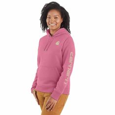 Cold winter mornings are a lot more comfortable with this women's cozy hoodie. Made of heavyweight fleece, the sweatshirt is brushed on the inside for extra softness. It has a relaxed fit that allows for easy layering, and it's finished with a Carhartt logo down the sleeve. Features10.5-ounce, 73% cotton / 27% polyesterThree-piece hood with drawcordRib-knit cuffs and waist help keep out the coldFront pouch pocketCarhartt signature logo printed on sleeve; Carhartt 'C' graphic on frontModel in Bla Carhartt Logo, Carhartt Womens, Safety Clothing, Winter Mornings, Cozy Hoodie, Work Wear Women, Work Tops, Women Hoodies Sweatshirts, Hoodie Top