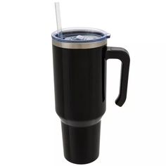 a black travel mug with a blue lid and straw sticking out of the cup, on a white background