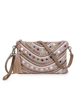 This Trendy Pastel Pink & Multi Sling from Anekaant's Ghoomar Collection is a must have in your accessory collection. Crafted in Acrylic Jacquard & Leatherette fabric & this bag features an Ethnic Motifs Embellished pattern decorated with Tassells. It comes with an Adjustable & Detachable Sling Strap and has 1 main compartment secured with a Zip closure. It has 2 inner pockets. ProductFeatures: Color: Pastel Pink & Multi Material: Acrylic Jacquard & Leatherette Work: Ethnic Motifs Embellished Le Festive Evening Bags With Tassels, Festive Party Bags With Tassels, Beaded Beige Bags For Festivals, Festival Beaded Beige Bags, Festival Party Bags With Tassels, Beige Beaded Festival Bags, Party Bags With Tassels For Festivals, Traditional Embellished Beige Shoulder Bag, Festive Bohemian Beaded Bag