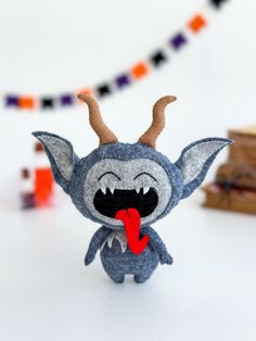 a small stuffed animal with horns on it's head